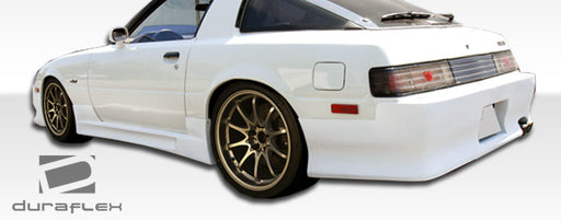 1979-1985 Mazda RX-7 Duraflex GP-1 Body Kit - 4 Piece - Includes GP-1 Front Bumper Cover ( 103638) GP-1 Side Skirts Rocker Panels (103639) GP-1 Rear Bumper Cover (103640)