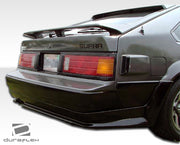 1982-1986 Toyota Supra Duraflex F-1 Body Kit - 4 Piece - Includes F-1 Front Under Spoiler Air Dam (100689) F-1 Rear Under Spoiler Air Dam (100690) F-1 Side Skirts Rocker Panels (100691)