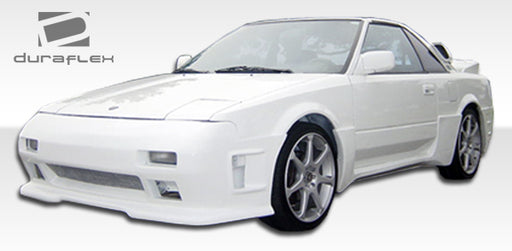 1985-1989 Toyota MR2 Duraflex F-1 Body Kit - 4 Piece - Includes F-1 Front Bumper Cover (100702) F-1 Rear Bumper Cover (100703) F-1 Side Skirts Rocker Panels (100704)