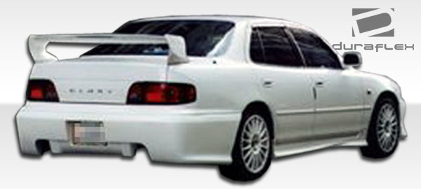 1992-1996 Toyota Camry 4DR Duraflex Swift Body Kit - 4 Piece - Includes Swift Front Bumper Cover (101207) Swift Rear Bumper Cover (101208) Swift Side Skirts Rocker Panels (101209)