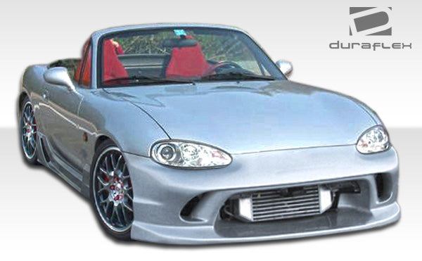 2001-2005 Mazda Miata Duraflex Wizdom Body Kit - 4 Piece - Includes Wizdom Front Bumper Cover (105960) Wizdom Side Skirts Rocker Panels (105961) Wizdom Rear Lip Under Spoiler Air Dam (105962)