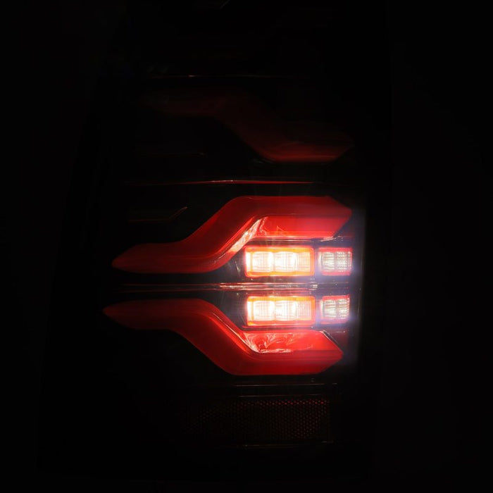 Feux arrière LED AlphaRex 05-15 Toyota Tacoma LUXX Noir/rouge avec lumière active/signal Seq